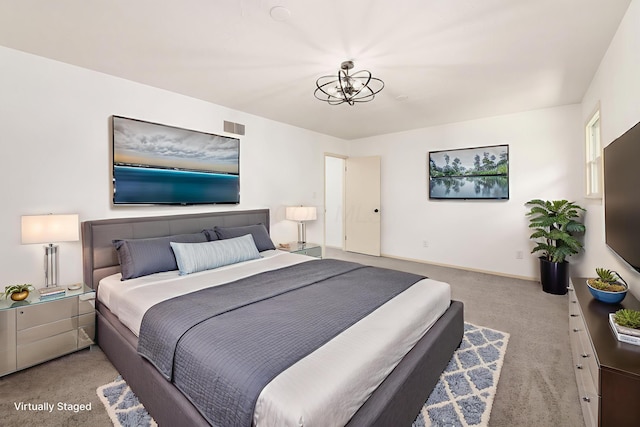 1571 Vinton Ave, Columbus, OH 43220 - carpeted bedroom featuring a chandelier and baseboards