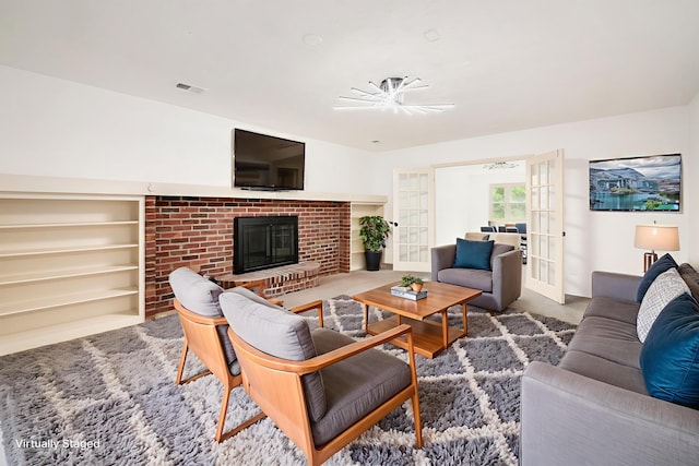 1571 Vinton Ave, Columbus, OH 43220 - living area with a brick fireplace and french doors