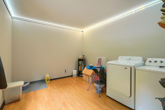 1300 Dannie Dr, Logan, OH 43138 - washroom with light wood-style flooring and washing machine and dryer