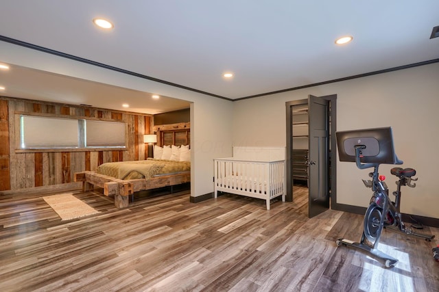 1300 Dannie Dr, Logan, OH 43138 - bedroom with wood finished floors, recessed lighting, wooden walls, and crown molding
