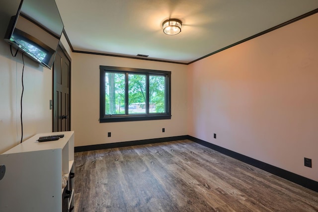 1300 Dannie Dr, Logan, OH 43138 - spare room with dark wood-style flooring and ornamental molding