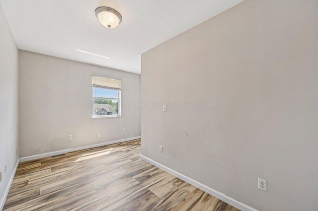 330 Tralee Trl, Cardington, OH 43315 - unfurnished room with wood finished floors and baseboards