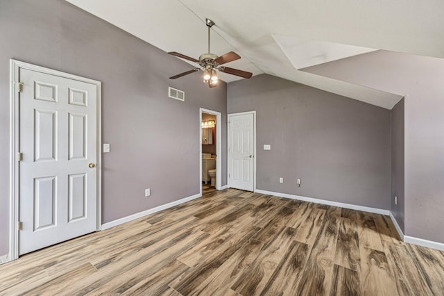 330 Tralee Trl, Cardington, OH 43315 - unfurnished bedroom with wood finished floors, ensuite bathroom, a ceiling fan, and high vaulted ceiling