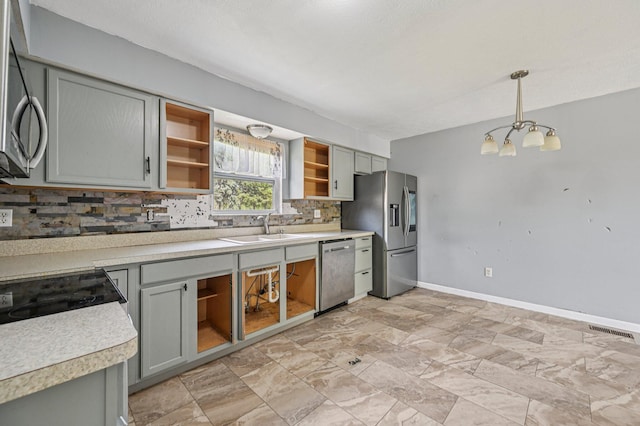 330 Tralee Trl, Cardington, OH 43315 - kitchen featuring open shelves, stainless steel appliances, backsplash, a chandelier, and light countertops