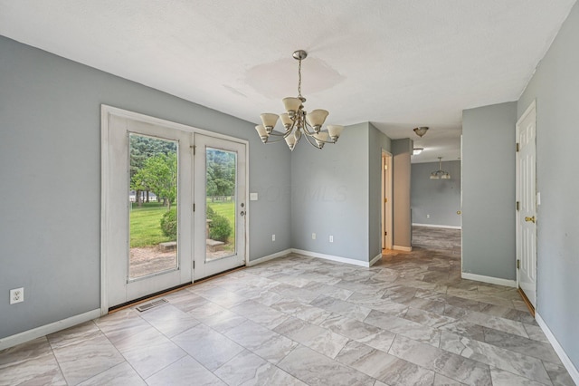 330 Tralee Trl, Cardington, OH 43315 - empty room featuring a chandelier and light marble finish flooring
