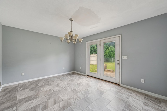 330 Tralee Trl, Cardington, OH 43315 - empty room with a chandelier and baseboards