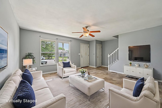330 Tralee Trl, Cardington, OH 43315 - living area featuring ceiling fan, stairway, and light stone finish floors