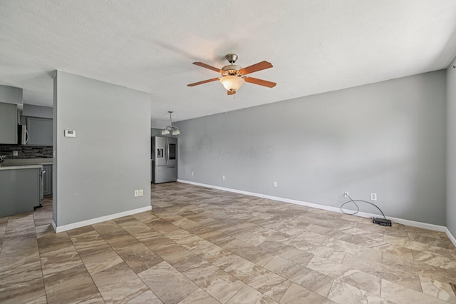 330 Tralee Trl, Cardington, OH 43315 - unfurnished living room with ceiling fan and baseboards