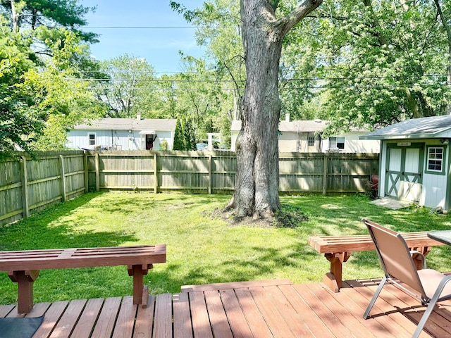 3811 Bradford Dr, Hilliard, OH 43026 - fenced backyard featuring a storage unit and a wooden deck