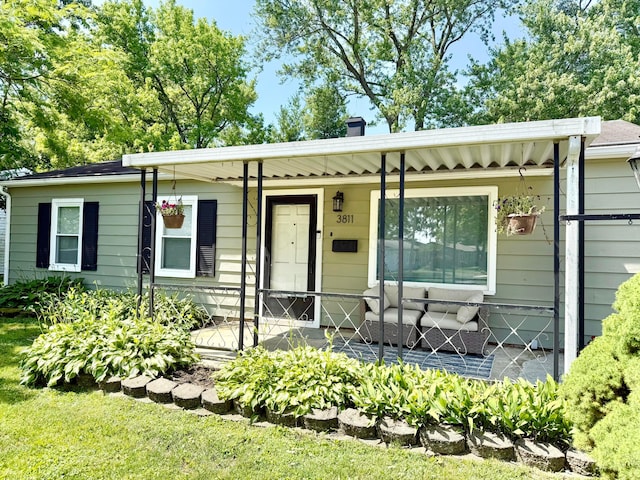 3811 Bradford Dr, Hilliard, OH 43026 - view of front of home with a porch and a chimney