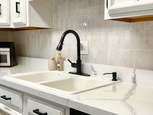 3811 Bradford Dr, Hilliard, OH 43026 - kitchen view of white cabinetry and tasteful backsplash