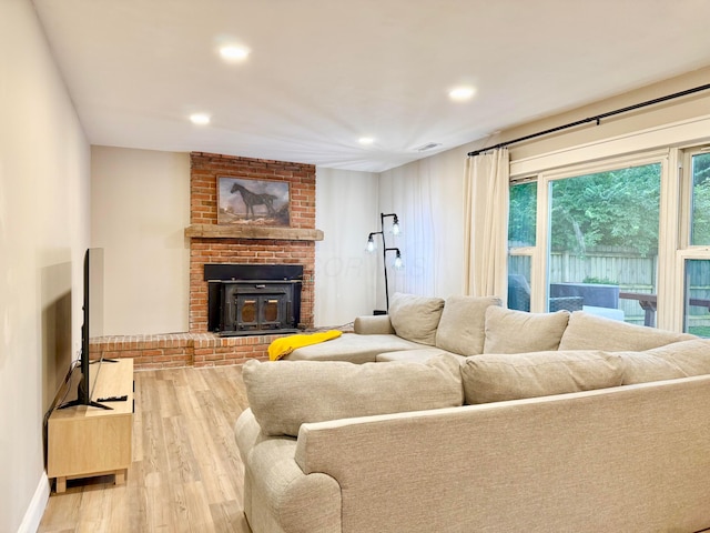 3811 Bradford Dr, Hilliard, OH 43026 - living room with wood finished floors, recessed lighting, and a fireplace