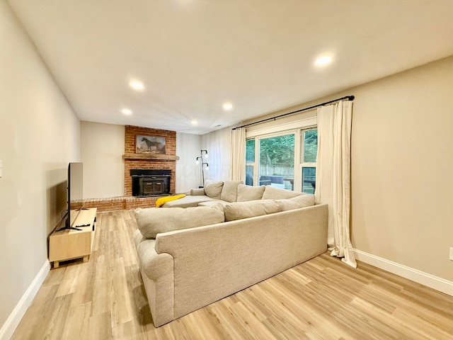 3811 Bradford Dr, Hilliard, OH 43026 - living area with light wood-style floors, a fireplace, and recessed lighting