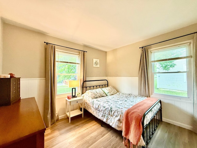 3811 Bradford Dr, Hilliard, OH 43026 - bedroom with light wood finished floors and wainscoting