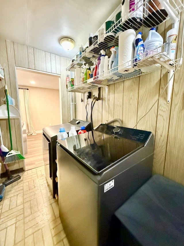 3811 Bradford Dr, Hilliard, OH 43026 - kitchen with brick floors, independent washer and dryer, and wooden walls