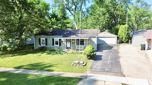 3811 Bradford Dr, Hilliard, OH 43026 - view of front of house featuring a porch, an attached garage, driveway, a front lawn, and roof with shingles