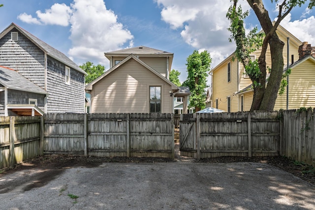 251 Detroit Ave, Columbus, OH 43201 - rear view of house with a fenced backyard and a gate