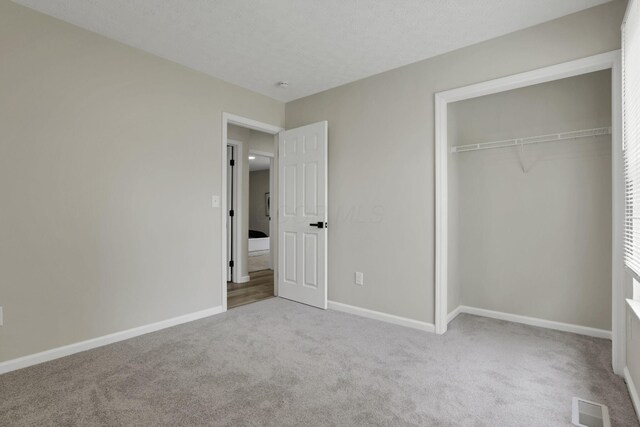 1021 Lavender Ln, Columbus, OH 43207 - unfurnished bedroom featuring carpet and a closet