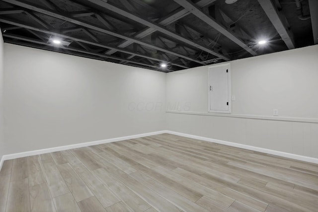 1021 Lavender Ln, Columbus, OH 43207 - finished basement featuring light wood-style floors and baseboards
