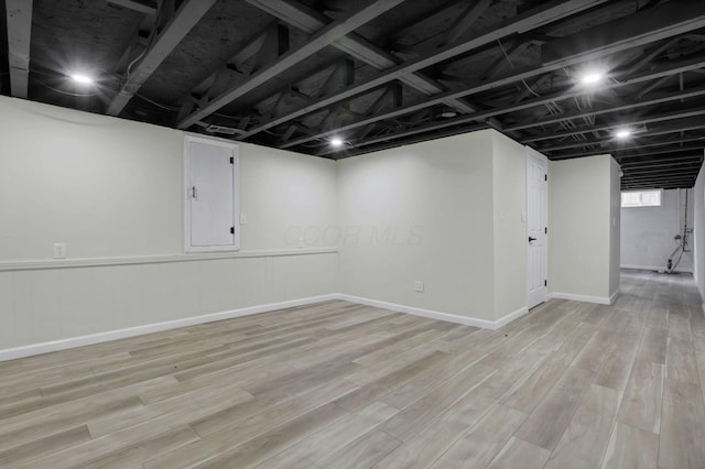 1021 Lavender Ln, Columbus, OH 43207 - basement with light wood-style flooring