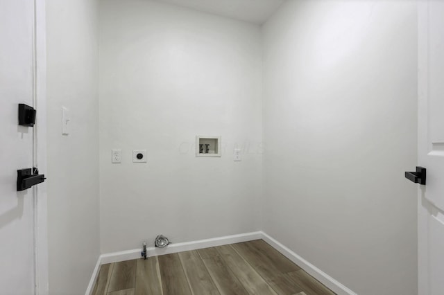 1021 Lavender Ln, Columbus, OH 43207 - washroom with gas dryer hookup, hookup for a washing machine, wood finished floors, and hookup for an electric dryer