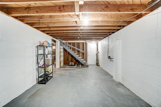 4851 Hillcrest St N, Hilliard, OH 43026 - unfinished basement featuring stairs and concrete block wall