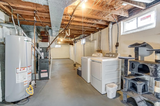 4851 Hillcrest St N, Hilliard, OH 43026 - basement featuring gas water heater, washer and dryer, and heating unit