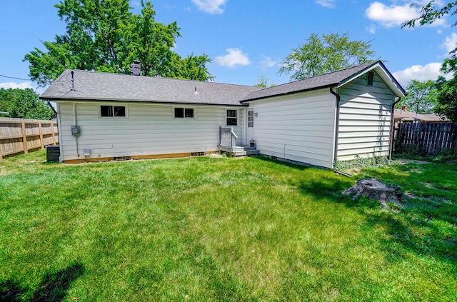 4851 Hillcrest St N, Hilliard, OH 43026 - back of property with a chimney and a shingled roof