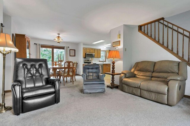6658 Ridpath Rd, Grove City, OH 43123 - living area featuring light colored carpet and stairway