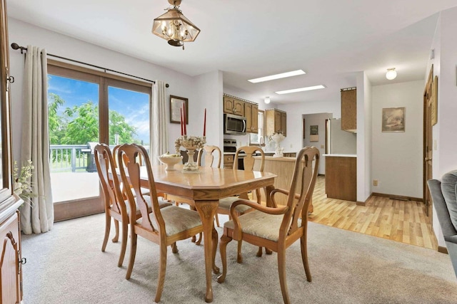 6658 Ridpath Rd, Grove City, OH 43123 - dining area featuring light colored carpet and a chandelier