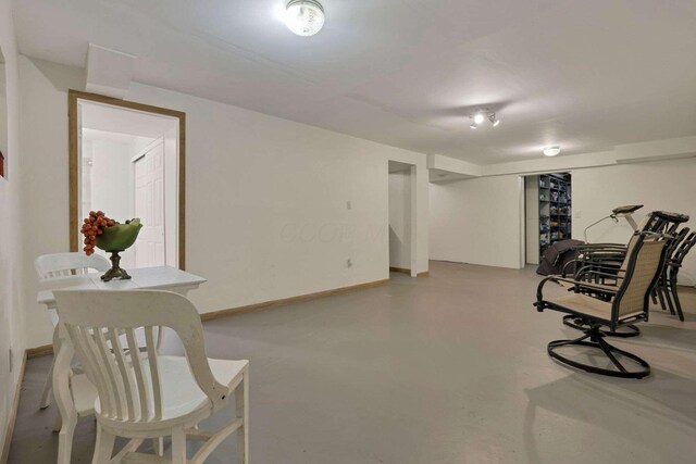 6658 Ridpath Rd, Grove City, OH 43123 - living area featuring finished concrete floors and baseboards
