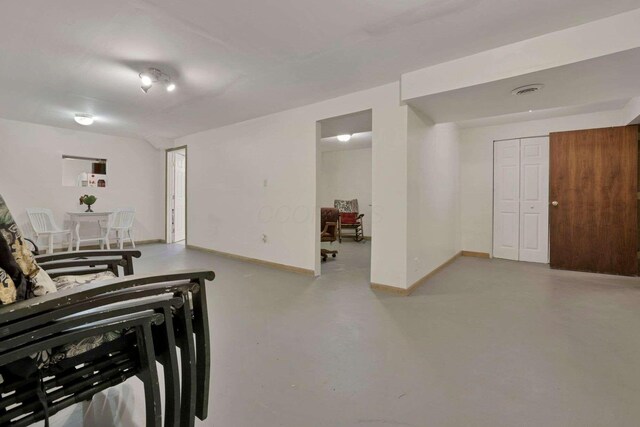 6658 Ridpath Rd, Grove City, OH 43123 - living area featuring finished concrete floors and baseboards