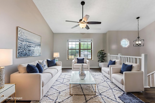 6063 Hildenboro Dr, Dublin, OH 43017 - living room featuring a ceiling fan, wood finished floors, a chandelier, and a textured ceiling