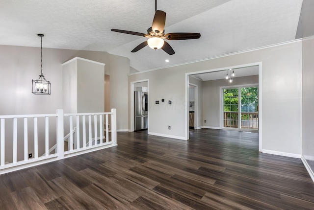 6063 Hildenboro Dr, Dublin, OH 43017 - empty room with dark wood finished floors, ceiling fan, a chandelier, and lofted ceiling