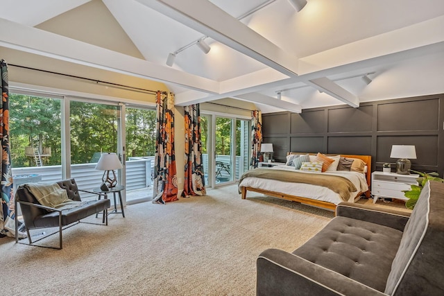 1318 Hickory Ridge Ln, Columbus, OH 43235 - carpeted bedroom featuring a decorative wall, access to outside, vaulted ceiling, and track lighting