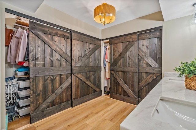 1318 Hickory Ridge Ln, Columbus, OH 43235 - foyer featuring a barn door and wood finished floors