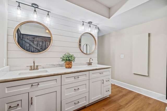 1318 Hickory Ridge Ln, Columbus, OH 43235 - bathroom featuring double vanity and wood finished floors