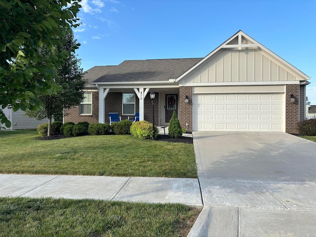 472 Randall Rd, Delaware, OH 43015 - ranch-style home featuring brick siding, a front yard, an attached garage, driveway, and board and batten siding