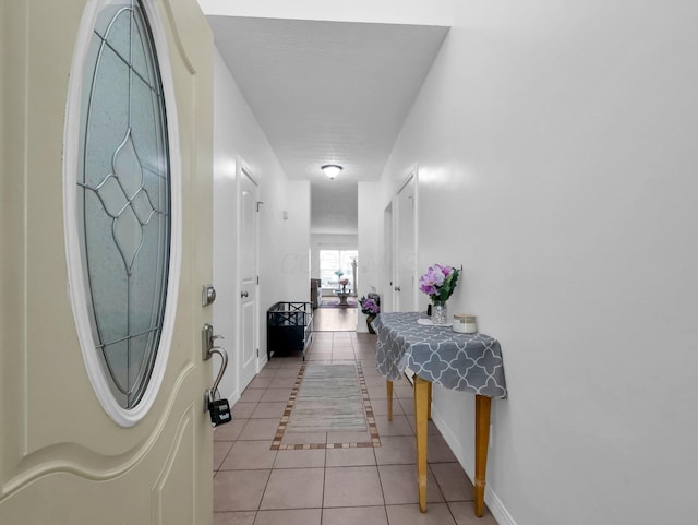 3136 Fabyan Dr, Reynoldsburg, OH 43068 - hallway featuring light tile patterned floors and baseboards