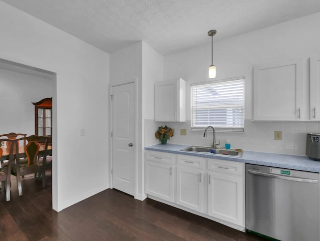 3136 Fabyan Dr, Reynoldsburg, OH 43068 - kitchen with dishwasher, dark wood-style floors, tasteful backsplash, white cabinetry, and a textured ceiling