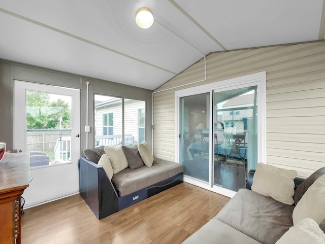 3136 Fabyan Dr, Reynoldsburg, OH 43068 - living room featuring vaulted ceiling, wood finished floors, and wood walls