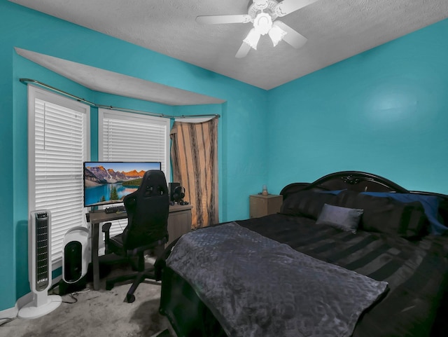 3136 Fabyan Dr, Reynoldsburg, OH 43068 - bedroom with ceiling fan, a desk, a textured ceiling, and carpet floors