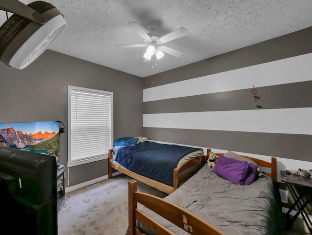 3136 Fabyan Dr, Reynoldsburg, OH 43068 - carpeted bedroom with a textured ceiling and ceiling fan