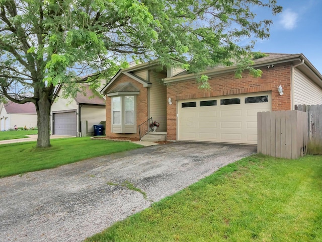 3136 Fabyan Dr, Reynoldsburg, OH 43068 - view of front of property with brick siding, driveway, and an attached garage