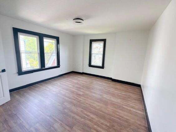 959 Kelton Ave, Columbus, OH 43206 - unfurnished room with healthy amount of natural light and wood finished floors