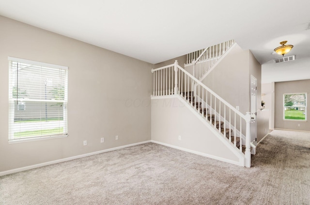 1171 Park Dr, Gahanna, OH 43230 - unfurnished living room featuring carpet floors and stairs