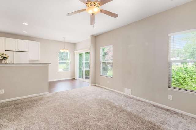 1171 Park Dr, Gahanna, OH 43230 - unfurnished living room featuring carpet floors, a chandelier, a ceiling fan, and recessed lighting