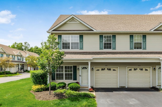 1171 Park Dr, Gahanna, OH 43230 - view of front facade featuring a garage, driveway, a front yard, and roof with shingles