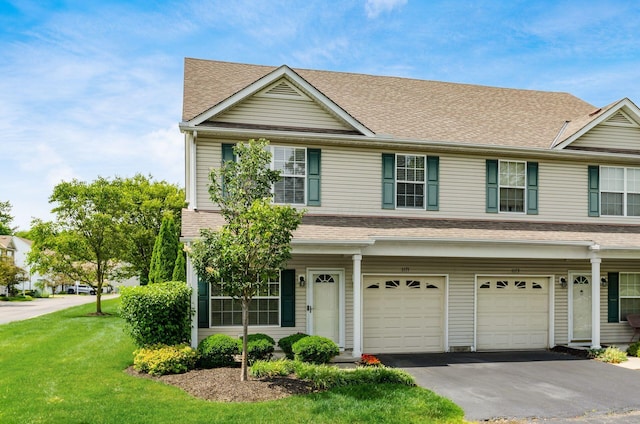 1171 Park Dr, Gahanna, OH 43230 - view of front of home with an attached garage, driveway, a front yard, and a shingled roof