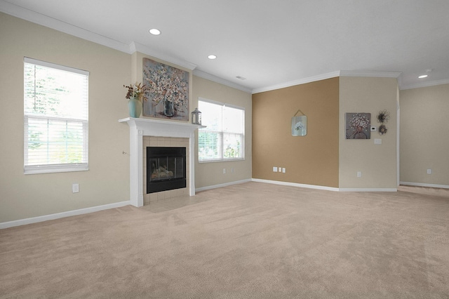 262 Alexander Lawrence Dr, Pickerington, OH 43147 - unfurnished living room featuring ornamental molding, light colored carpet, recessed lighting, and a tile fireplace
